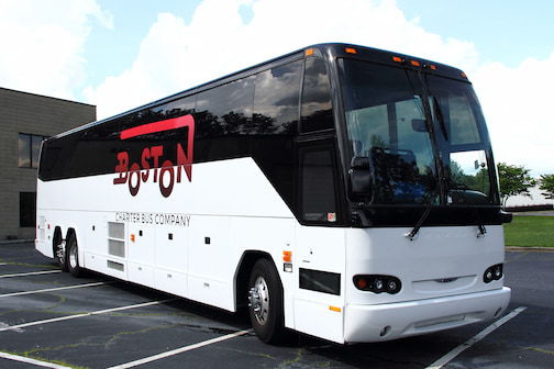 a plain white charter bus with a 